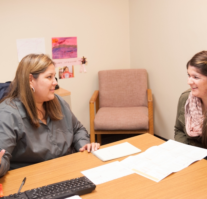 Adviser and student at desk